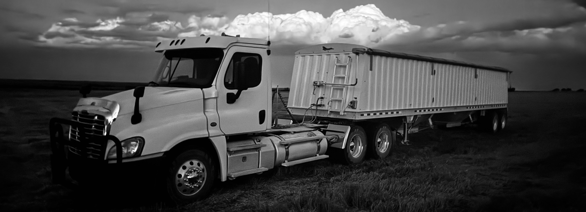 Semi Truck late evening wheat harvest