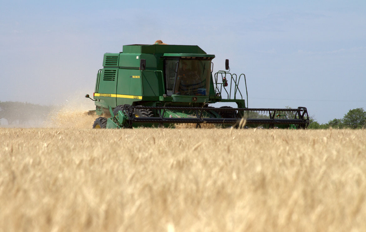 Combine in Kansas Wheat Field